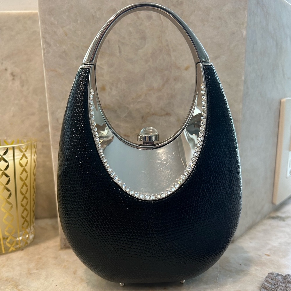 Black and silver hard shell clutch bag with detachable chain!